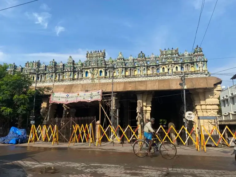 Colorful temple with bicycle passing by