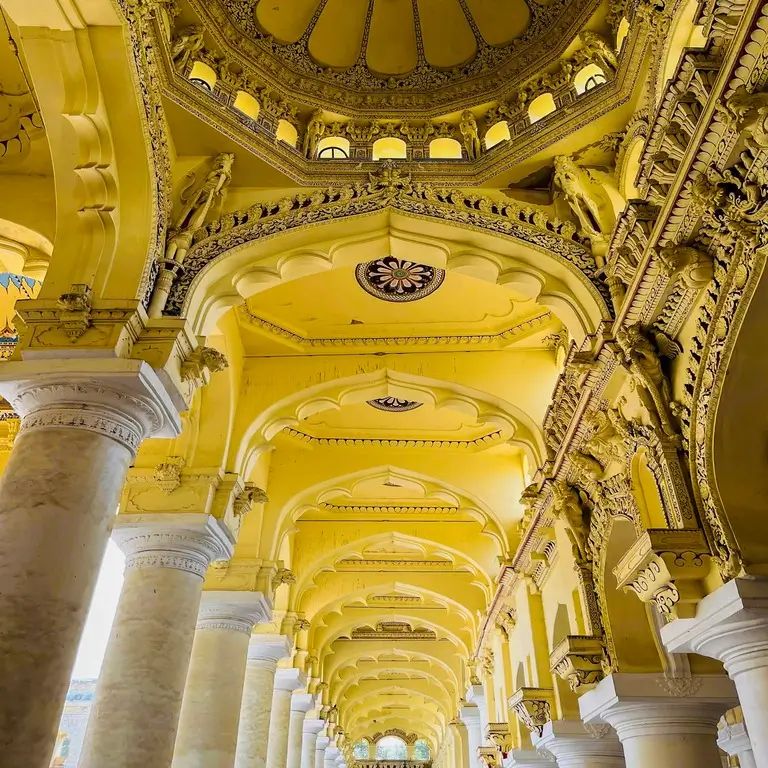 Ornate yellow arches and columns