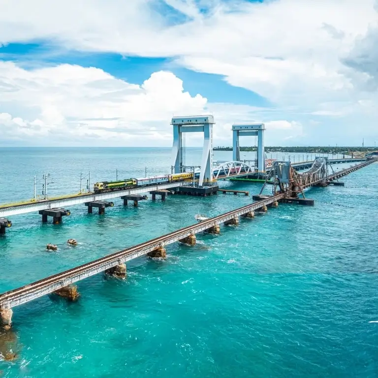 Bridge over turquoise water, cloudy sky