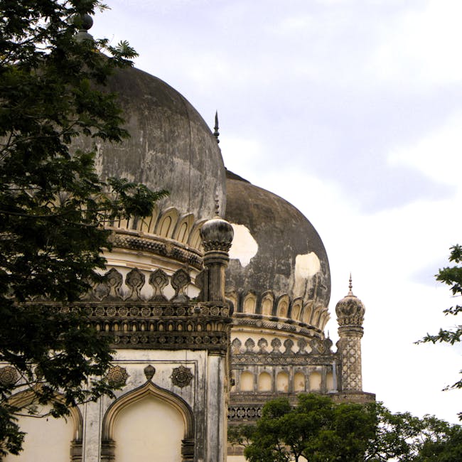 Qutub Shahi tombs with domes in Hyderabad, India, showcasing Mughal architecture.