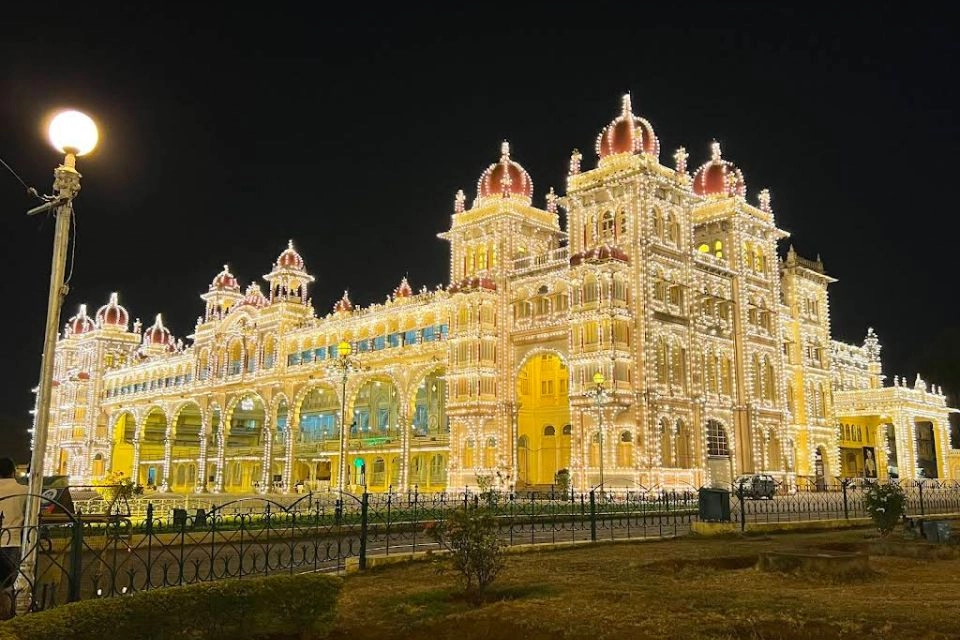 Mysore destination – Mysore Palace illuminated at night, yoga capital of India